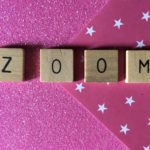 The word ZOOM on a pink background